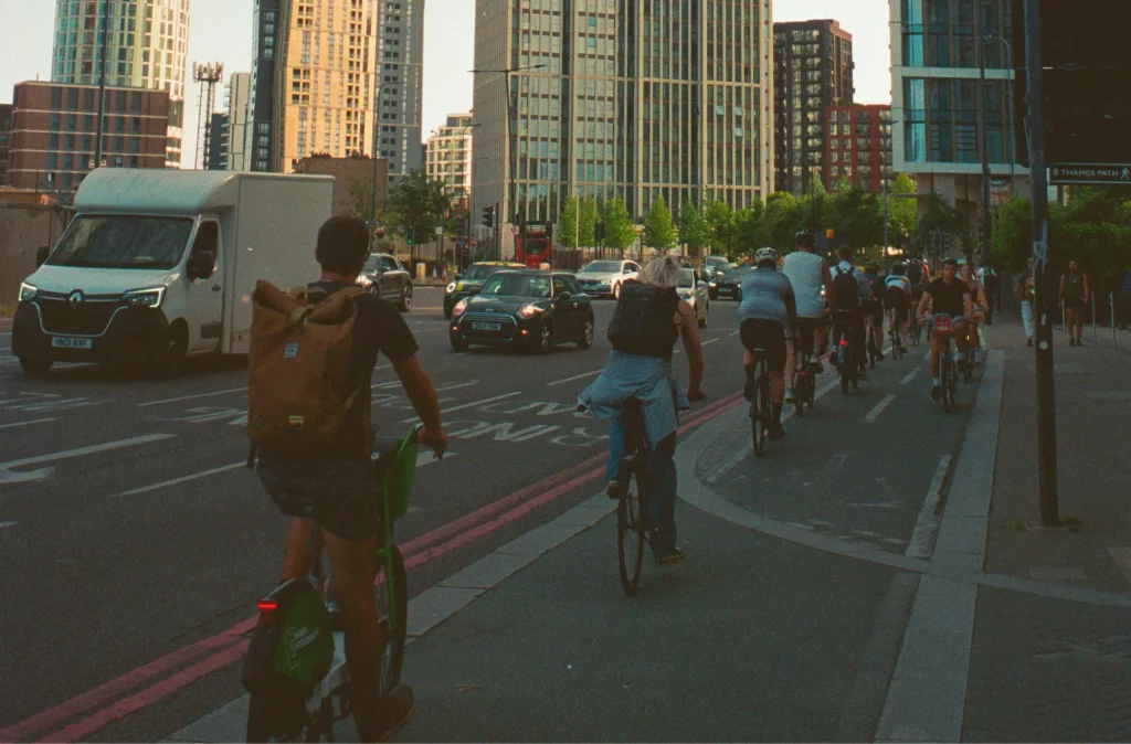 Is Cycling to work dangerous? A busy cylcle lane next to a main road on a sunny morning.