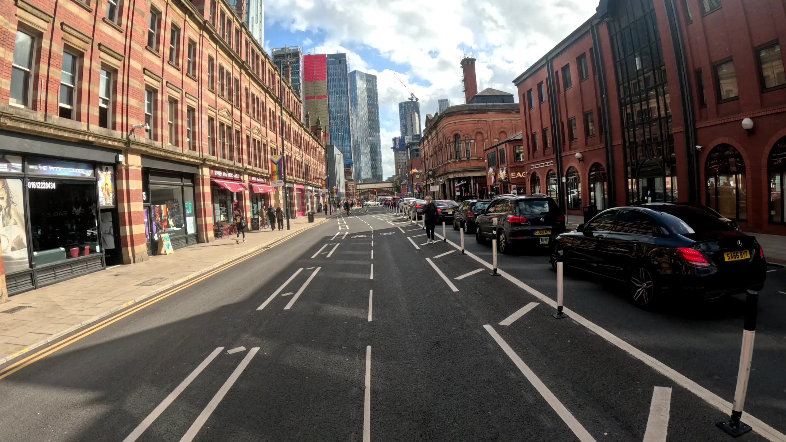 A image of a segregated inner city cycle lane on a sunny day.