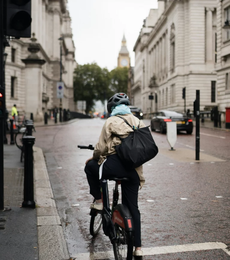 A cyclist sat at a red light on a London Santander bike