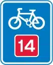 A blue sign showing the start of a cycle highway