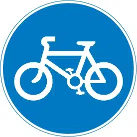 A blue round sign showing the start of a cycle lane